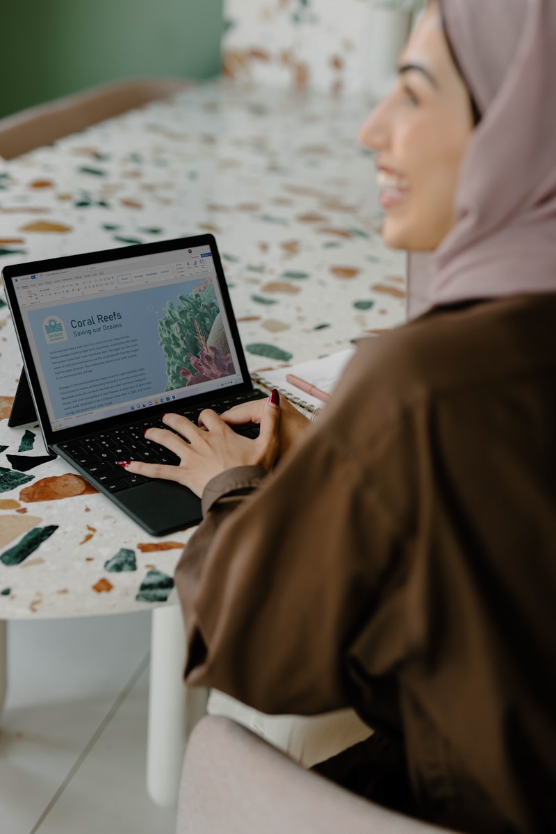 a person using a laptop working in her home-based business